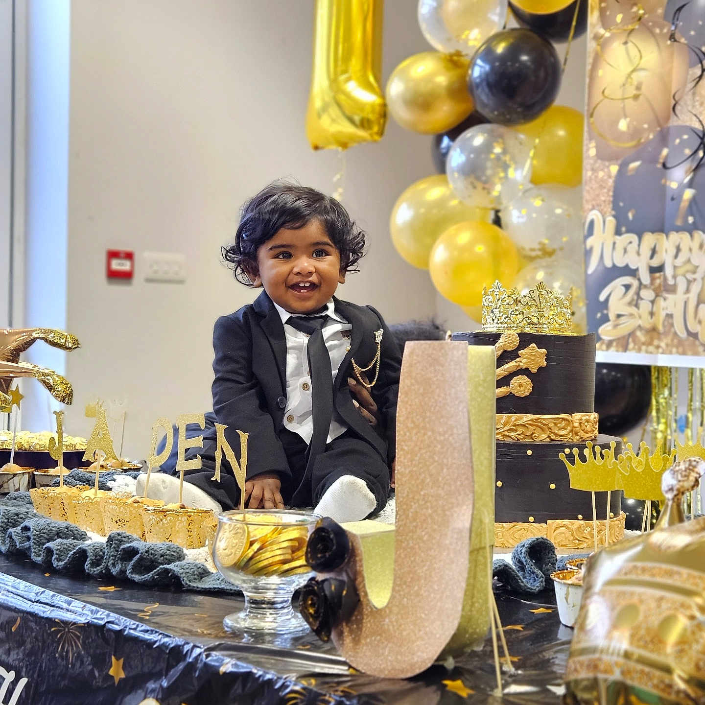 Jaden is registered to the contest to win money with this photo: accessories, adult, birthdayparty, boy, bridegroom, cake, child, clothing, dessert, food, formalwear, fun, glove, male, party, people, person, tie, wedding, weddingcake
