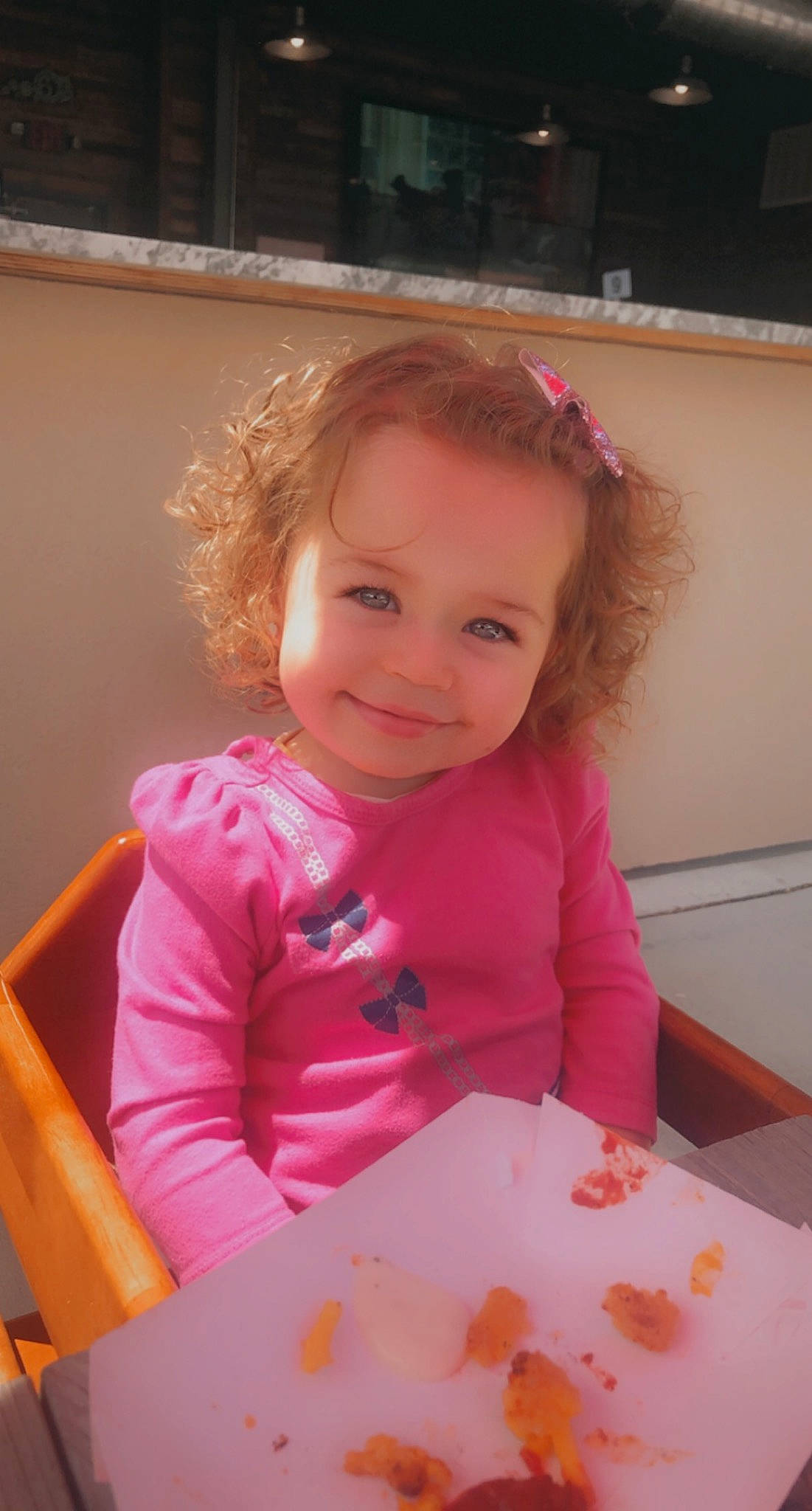 Maliya is registered to the contest to win money with this photo: baby, baby_toddler_clothing, chair, cheek, child, comfort_food, face, fun, happy, joy, magenta, person, pink, plate, play, room, sitting, skin, smile, table