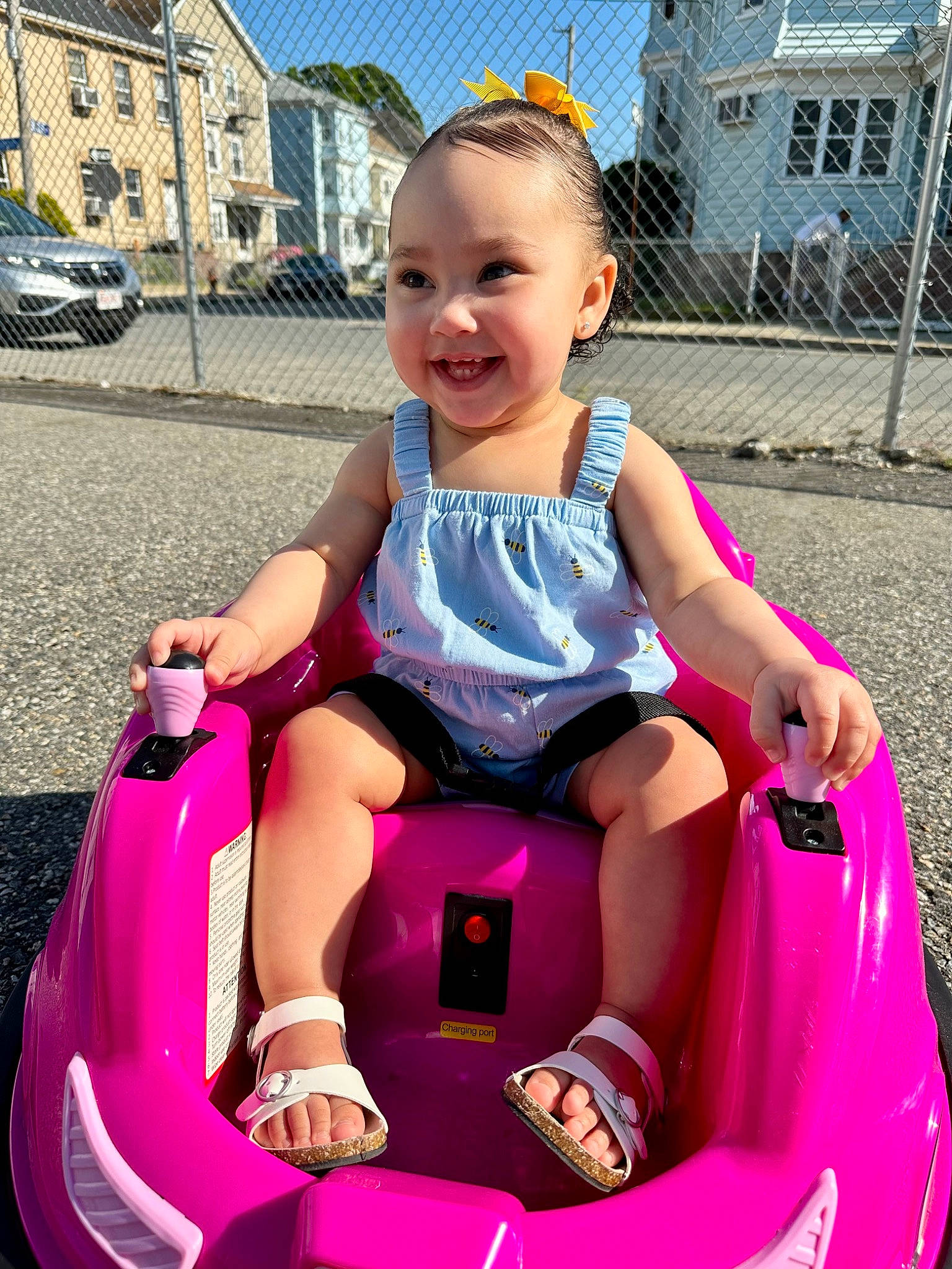 Annalise joined the competition — help win amazing prizes! automotive_exterior, baby_toddler_clothing, bumper, facial_expression, fun, happy, joy, leisure, motor_vehicle, person, photograph, pink, riding_toy, shorts, smile, summer, tire, toddler, travel, vehicle