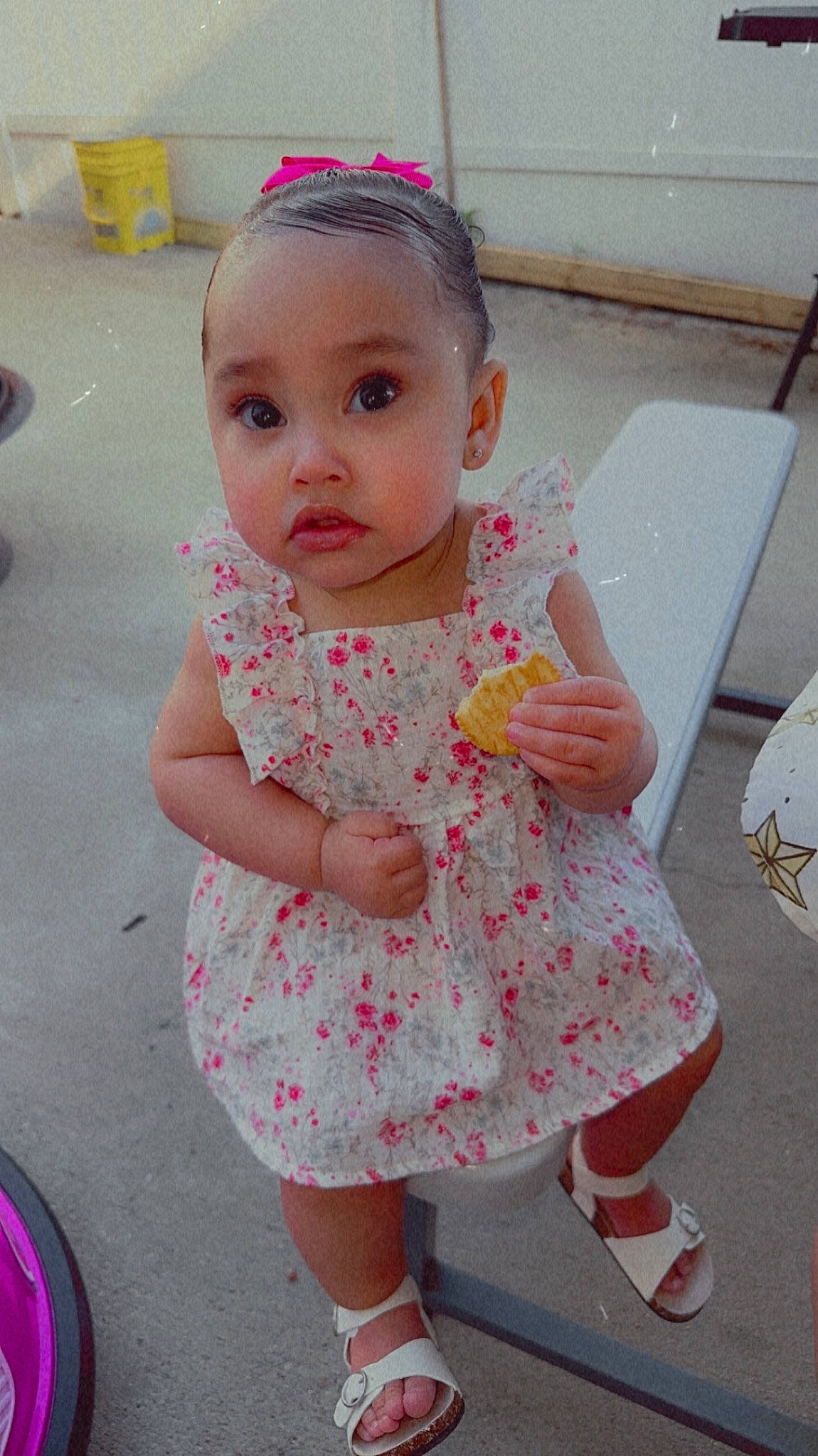 Annalise is registered to the contest to win money with this photo: baby, baby_toddler_clothing, cheek, child, day_dress, dress, eyelash, face, fun, gesture, happy, head, lip, magenta, pattern, person, pink, sandal, skin, surprise