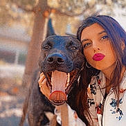 Tyson a rejoint le concours — aidez-le/la à gagner de superbes lots ! woman, dog, outdoor, portrait, happy, animal, pet, face, person, canine, nature, tree, casual_clothing, long_hair, smile, tongue, friendship, daylight, animal_companion, leisure