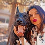 woman, dog, outdoor, portrait, happy, animal, pet, face, person, canine, nature, tree, casual_clothing, long_hair, smile, tongue, friendship, daylight, animal_companion, leisure