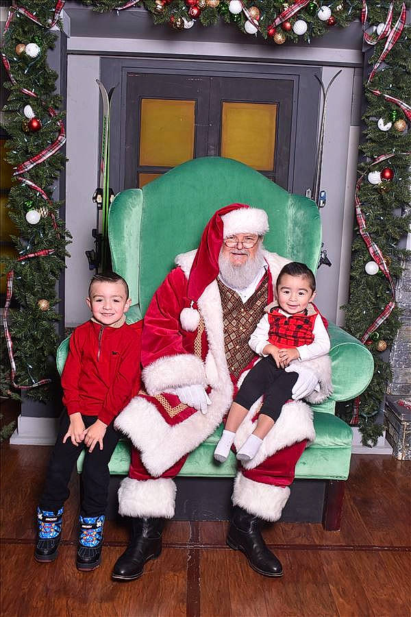 Aiden is registered to the contest to win money with this photo: boot, child, christmas, christmas_decoration, christmas_tree, event, fun, green, happy, hat, holiday, joy, lap, person, red, santa_claus, smile, snapshot, toddler, tree