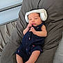 baby, infant, headphones, pillow, romper, clothing, foot, hand, face, bed, blanket, resting, cute, child, indoor, person, newborn, relaxed, sleepwear, small