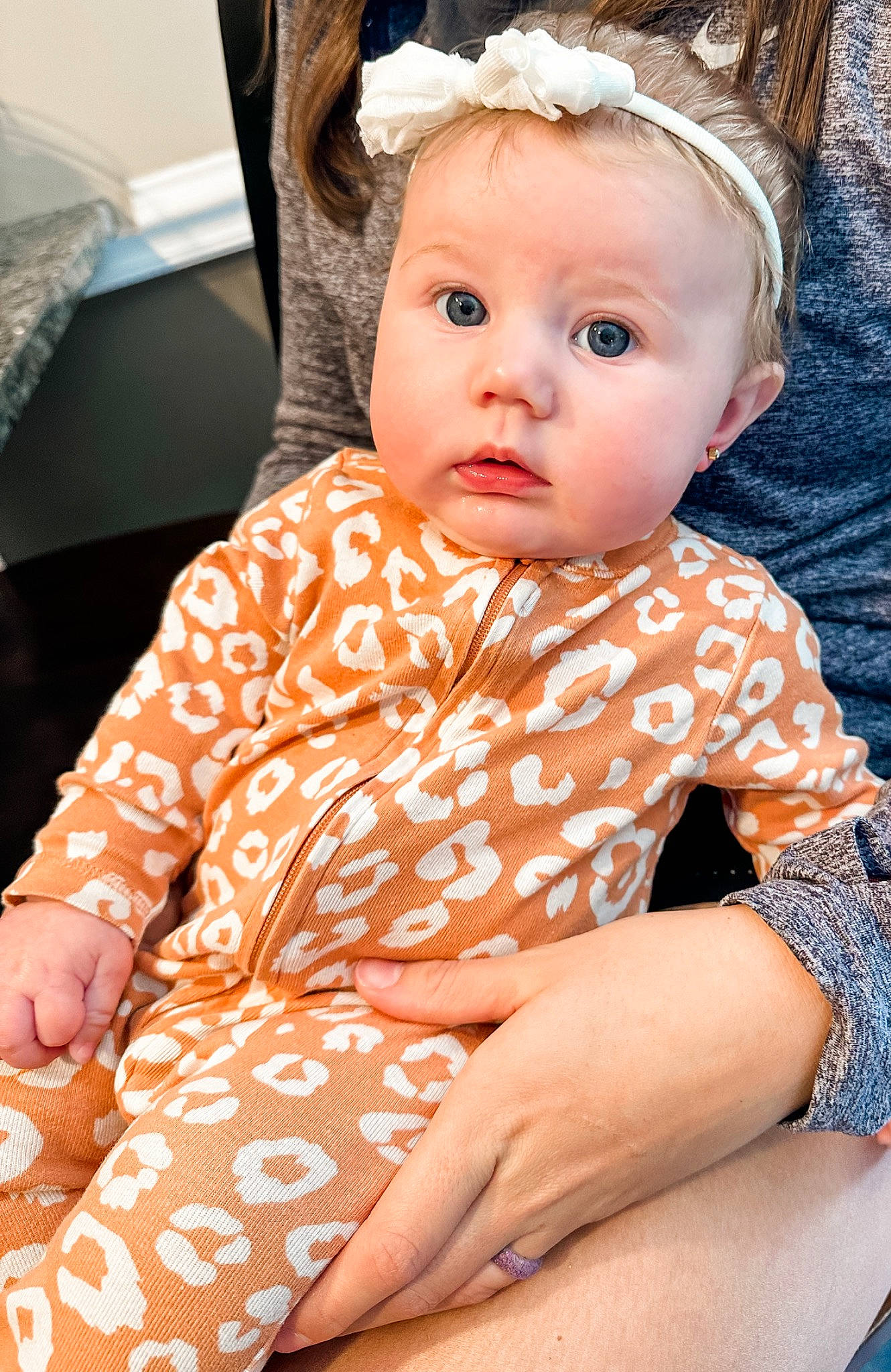 Kinlee is registered to the contest to win money with this photo: arm, baby, baby_toddler_clothing, blond, cheek, child, chin, comfort, eye, eyelash, face, happy, head, human_body, iris, person, pink, sitting, skin, sleeve