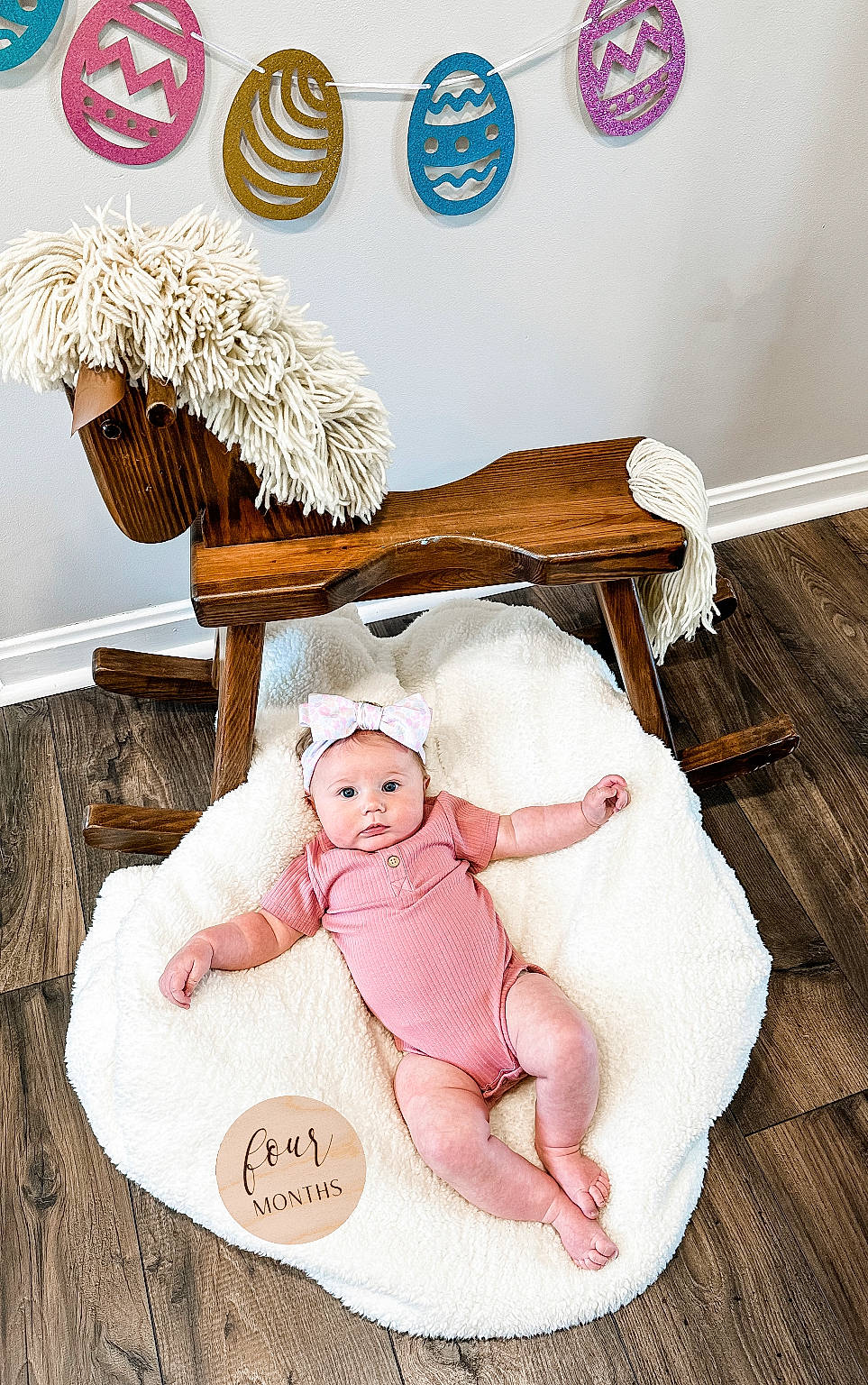 Kinlee joined the competition — help win amazing prizes! baby, baby_products, baby_safety, baby_sleeping, baby_toddler_clothing, baby_toys, bedding, child, comfort, font, hardwood, headwear, home_accessories, infant_bed, linens, pattern, peach, person, room, sitting