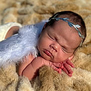 Averie is registered to the contest to win money with this photo: newborn, baby, sleeping, headband, feathers, blanket, soft, closeup, face, peaceful, cute, infant, skin, hand, resting, portrait, cozy, tiny, adorable, child