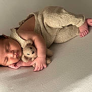 Alonzo joined the competition — help win amazing prizes! baby, sleeping, teddy_bear, knitwear, infant, cozy, soft_light, peaceful, newborn, cute, cuddling, child, portrait, fingers, toes, fabric, resting, indoors, closeup, warm