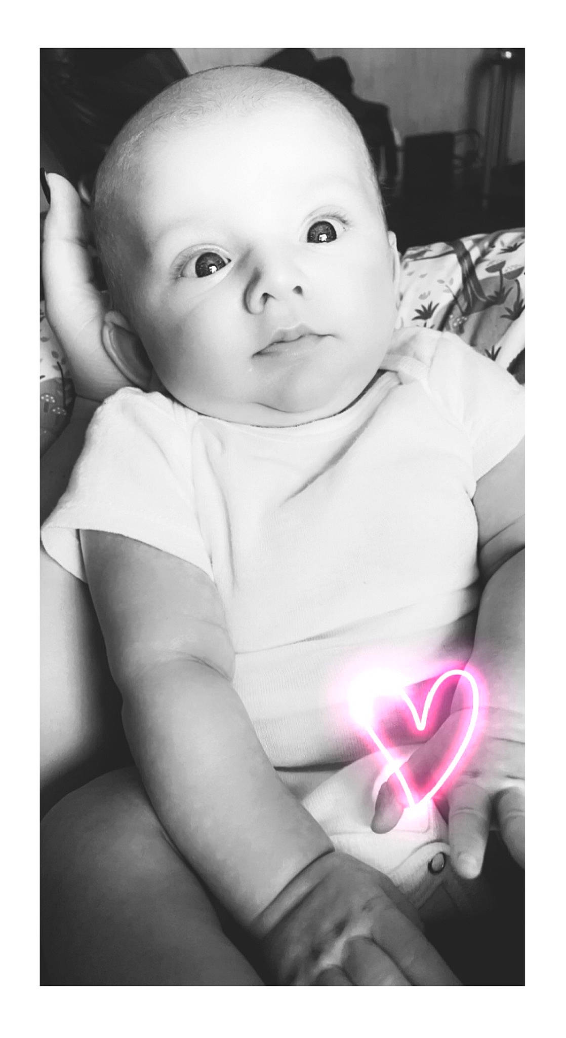 Deegan is registered to the contest to win money with this photo: baby, baby_toddler_clothing, beauty, cheek, child, finger, flash_photography, flower, gesture, happy, iris, lip, monochrome_photography, person, petal, photograph, skin, snapshot, style, toddler