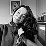 Verlaine a rejoint le concours — aidez-le/la à gagner de superbes lots ! animal, appliance, black_and_white, casual, clock, companion, cozy, cute, dog, face, friendly, home, hug, indoor, kitchen, pet, portrait, smile, sweater, woman