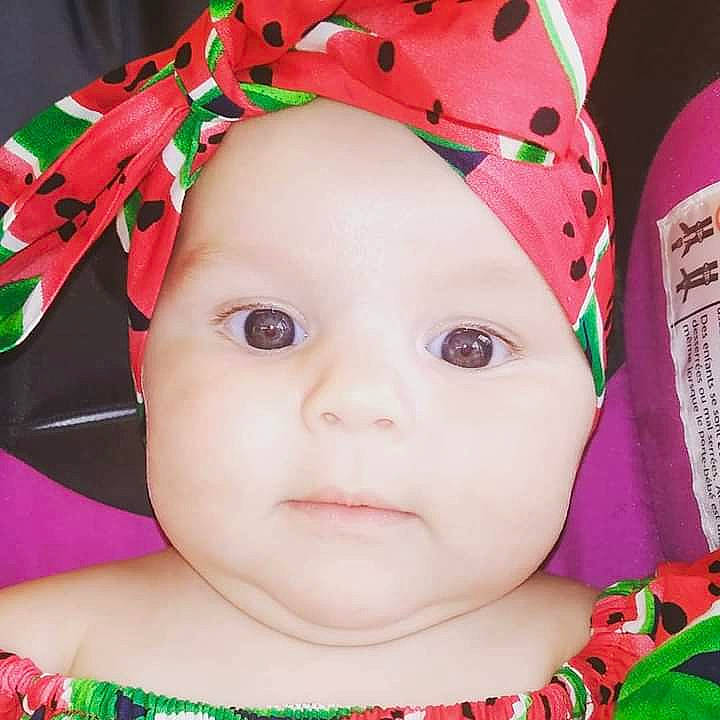 Scottlyn is registered to the contest to win money with this photo: baby, beauty, cheek, child, close_up, ear, eye, face, forehead, hair_accessory, head, headgear, lip, mouth, nose, person, pink, product, skin, toddler
