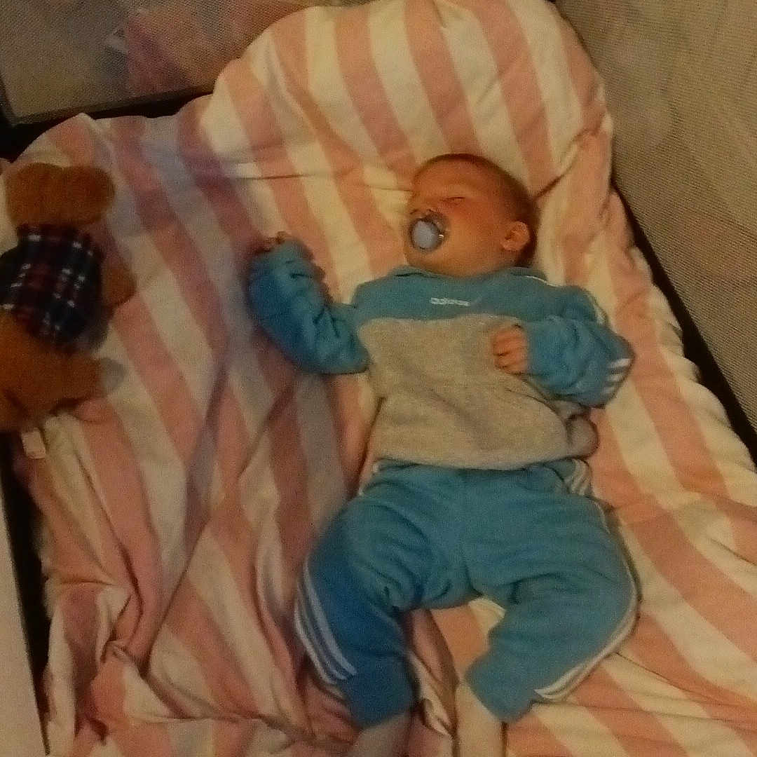 Ronnie Oliver joined the competition — help win amazing prizes! baby, bedtime, blanket, blue_clothing, child, comfort, cozy, crib, cute, indoors, infant, nursery, pacifier, peaceful, pink_stripes, resting, sleeping, sleepwear, soft_toy, teddy_bear