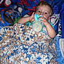 baby, bed, bedding, bedroom, blanket, bottle, cartoon, child, comfort, crochet, cute, drink, indoor, nap, person, rest, sleepy, spiderman, superhero, toy