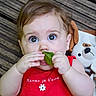 baby, blanket, child, closeup, curious, cute, expression, eyes, face, hand, indoors, infant, leaf, person, plush_toy, portrait, red_clothing, sitting, smiling, wooden_floor