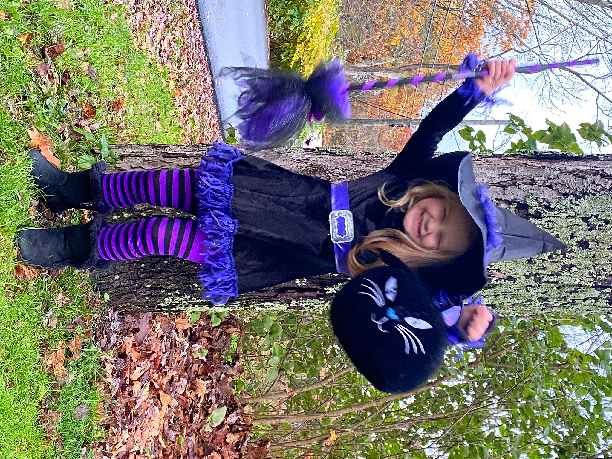 Abigail is registered to the contest to win money with this photo: blue, botany, clothing, costume, electric_blue, flower, fun, grass, happy, hat, headwear, joy, leisure, magenta, people_in_nature, person, plant, purple, shoe, smile