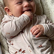 Blake joined the competition — help win amazing prizes! baby, infant, smiling, onesie, horse_pattern, blanket, cozy, hand, face, cheerful, soft_texture, child, cute, lying_down, happy, young_child, clothing, comfort, indoor, portrait