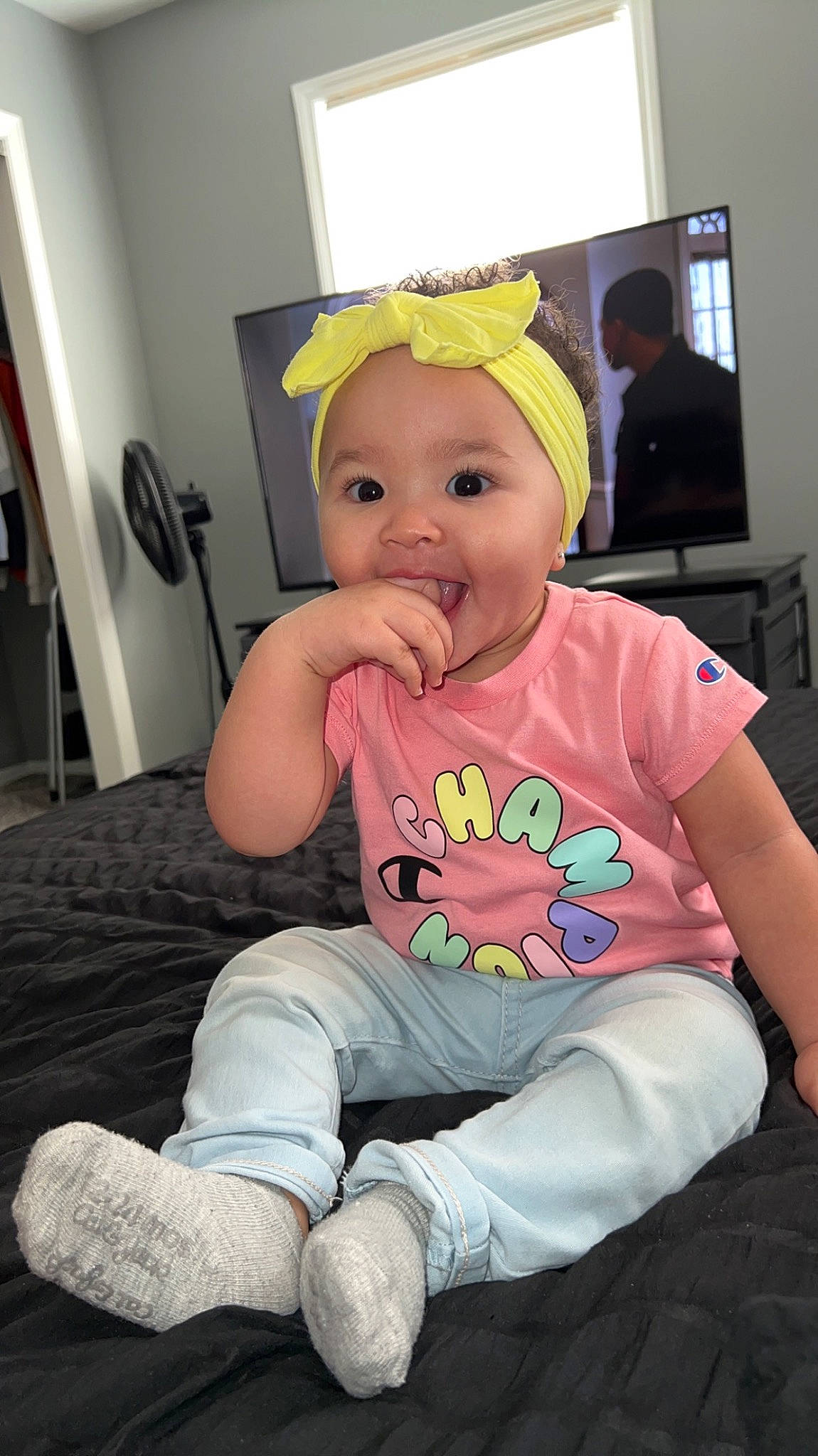 Kalayah joined the competition — help win amazing prizes! baby, baby_toddler_clothing, cheek, child, comfort, event, facial_expression, finger, fun, happy, head, headwear, lap, person, sitting, skin, sleeve, smile, sock, t_shirt