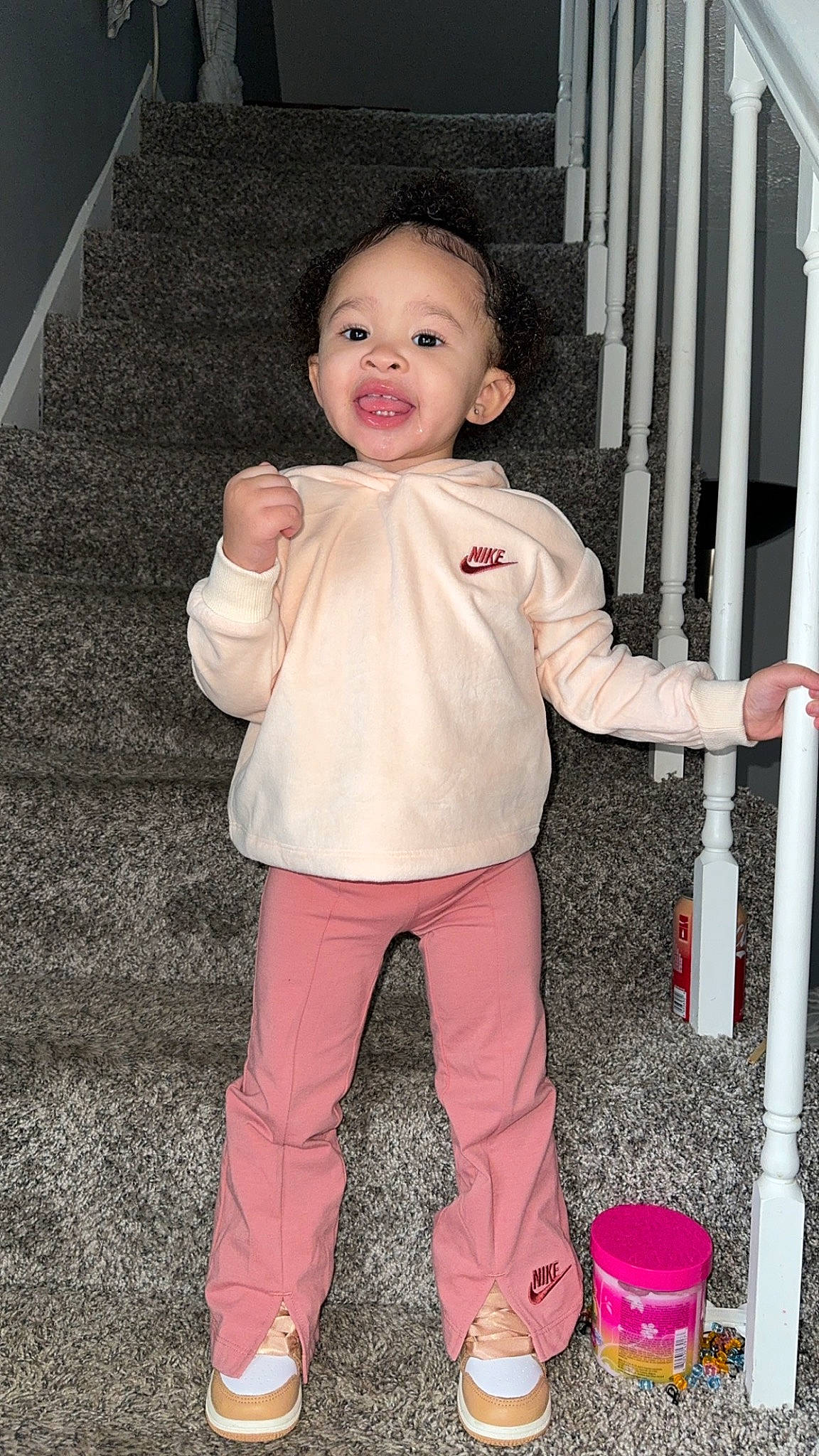 Kalayah joined the competition — help win amazing prizes! baby, baby_toddler_clothing, cheek, child, facial_expression, finger, flooring, fun, gesture, happy, pattern, person, pink, play, skin, sleeve, smile, standing, thumb, toddler