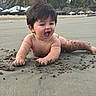 baby, child, beach, sand, tropical, palm_trees, resort, outdoor, crawling, sitting, yawning, smiling, happy, portrait, barefoot, infant, shoreline, umbrellas, vacation, sunlight
