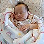 Presley is registered to the contest to win money with this photo: baby, newborn, sleeping, blanket, soft, hand, face, infant, cute, peaceful, child, bed, floral, pattern, clothing, pajamas, rest, portrait, closeup, indoors