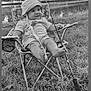 baby, baby_clothes, black_and_white, chair, child, cute, fishing, fishing_rod, grass, hat, leisure, nature, outdoor, person, recreation, relaxing, smiling, summer, trees, water