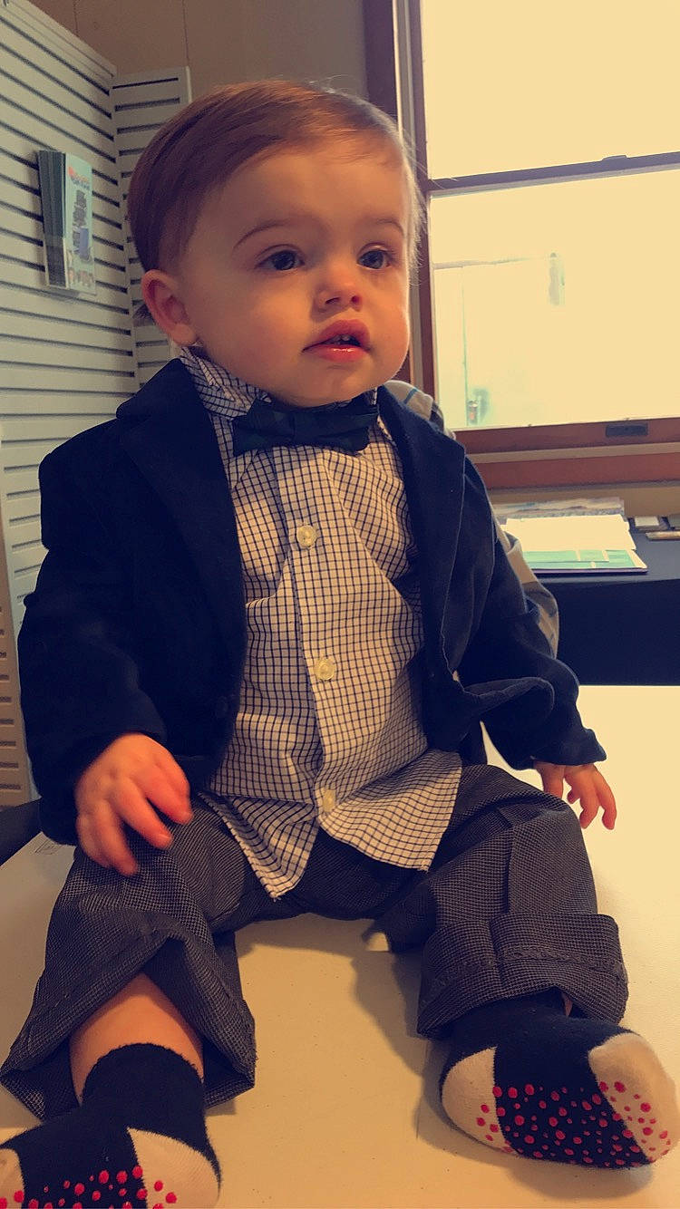 Ashtin joined the competition — help win amazing prizes! baby, baby_toddler_clothing, bow_tie, cheek, child, formal_wear, outerwear, person, sitting, suit, tie, toddler, tuxedo