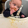 baby, high_chair, messy, food, face, hand, tray, curious, indoor, child, clothing, seatbelt, expression, feeding, infant, cute, portrait, mess, dining, kitchen