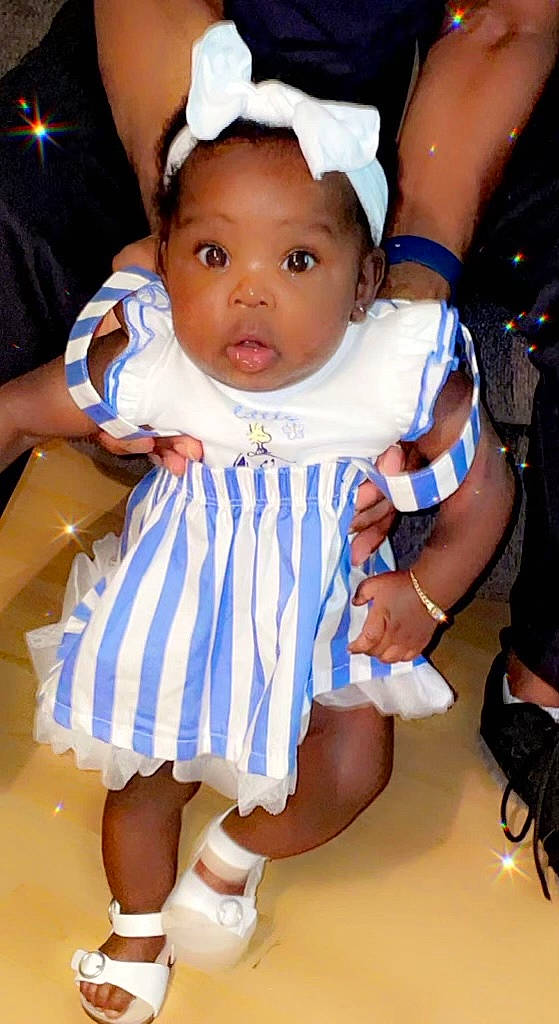 Cali is registered to the contest to win money with this photo: baby, baby_products, baby_toddler_clothing, cheek, child, electric_blue, event, fashion_accessory, finger, fun, gesture, happy, iris, luggage_and_bags, person, pink, purple, skin, thumb, toddler