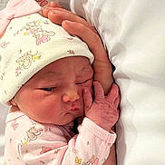 Laynie Reynolds joined the competition — help win amazing prizes! baby, infant, newborn, hat, pink_clothing, hand, sleeping, cute, resting, soft, bed, blanket, person, face, skin, child, cozy, toddler, cute_expression, mickey_mouse