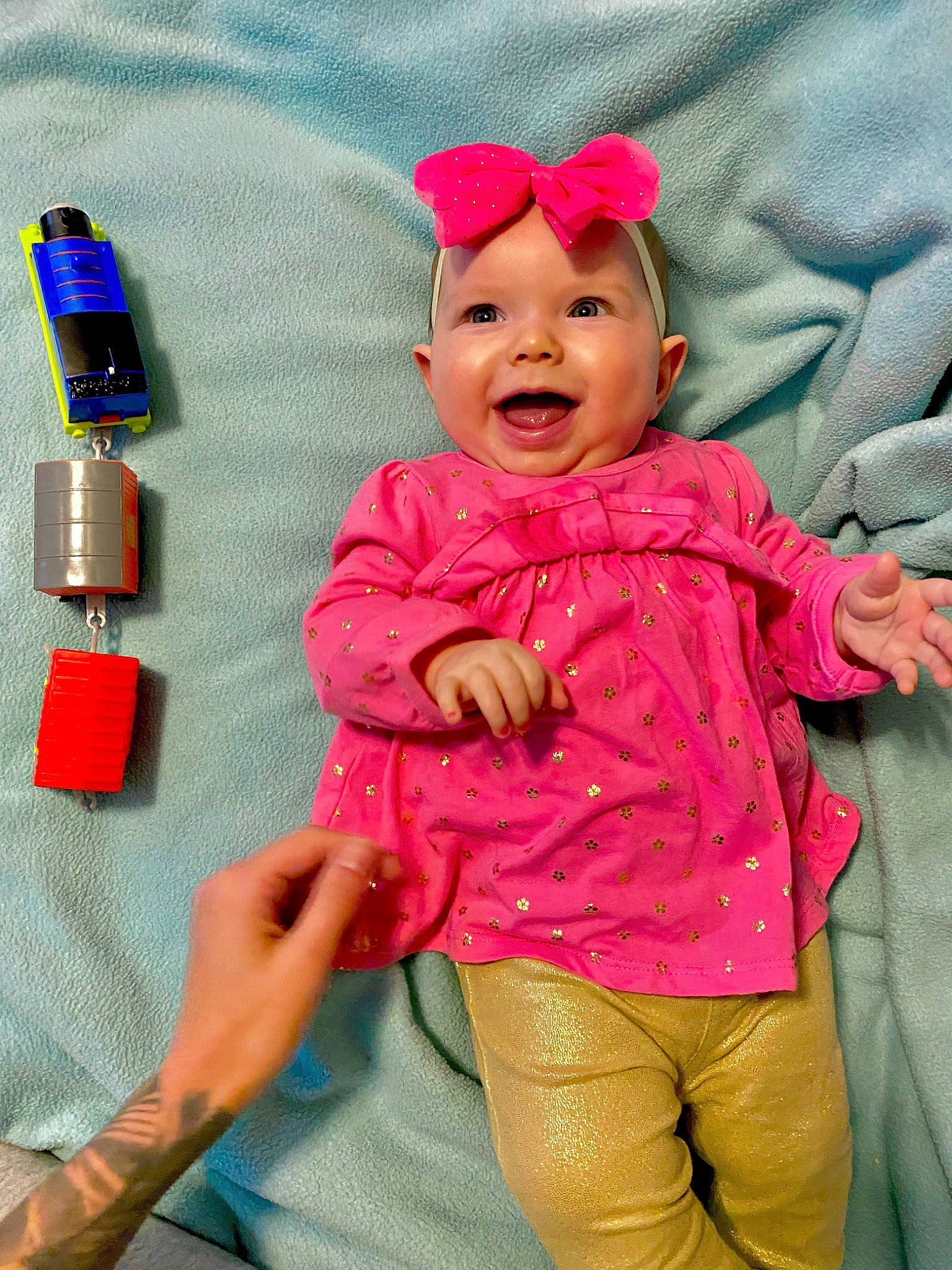 Maelynn joined the competition — help win amazing prizes! baby, baby_toddler_clothing, cheek, child, fashion_accessory, finger, fun, gesture, happy, head, headwear, magenta, pattern, person, pink, play, product, skin, sleeve, smile