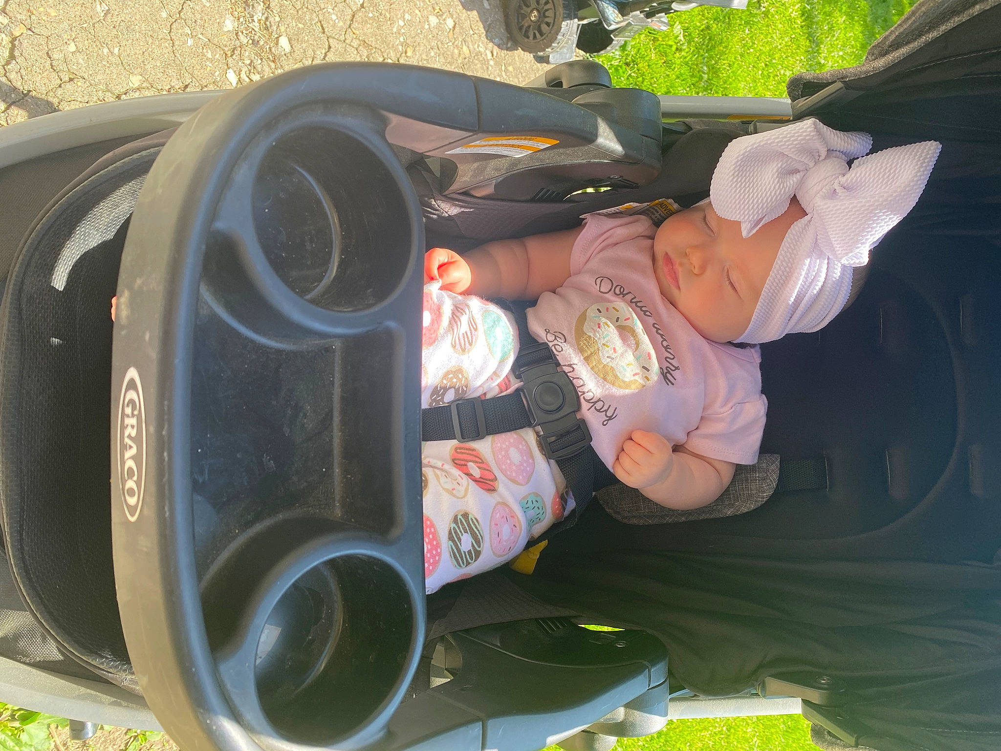 Maelynn is registered to the contest to win money with this photo: audio_equipment, automotive_design, automotive_exterior, automotive_lighting, automotive_tire, automotive_wheel_system, bumper, car, fender, green, hat, headgear, headwear, light, motor_vehicle, person, plant, tire, tree, vehicle