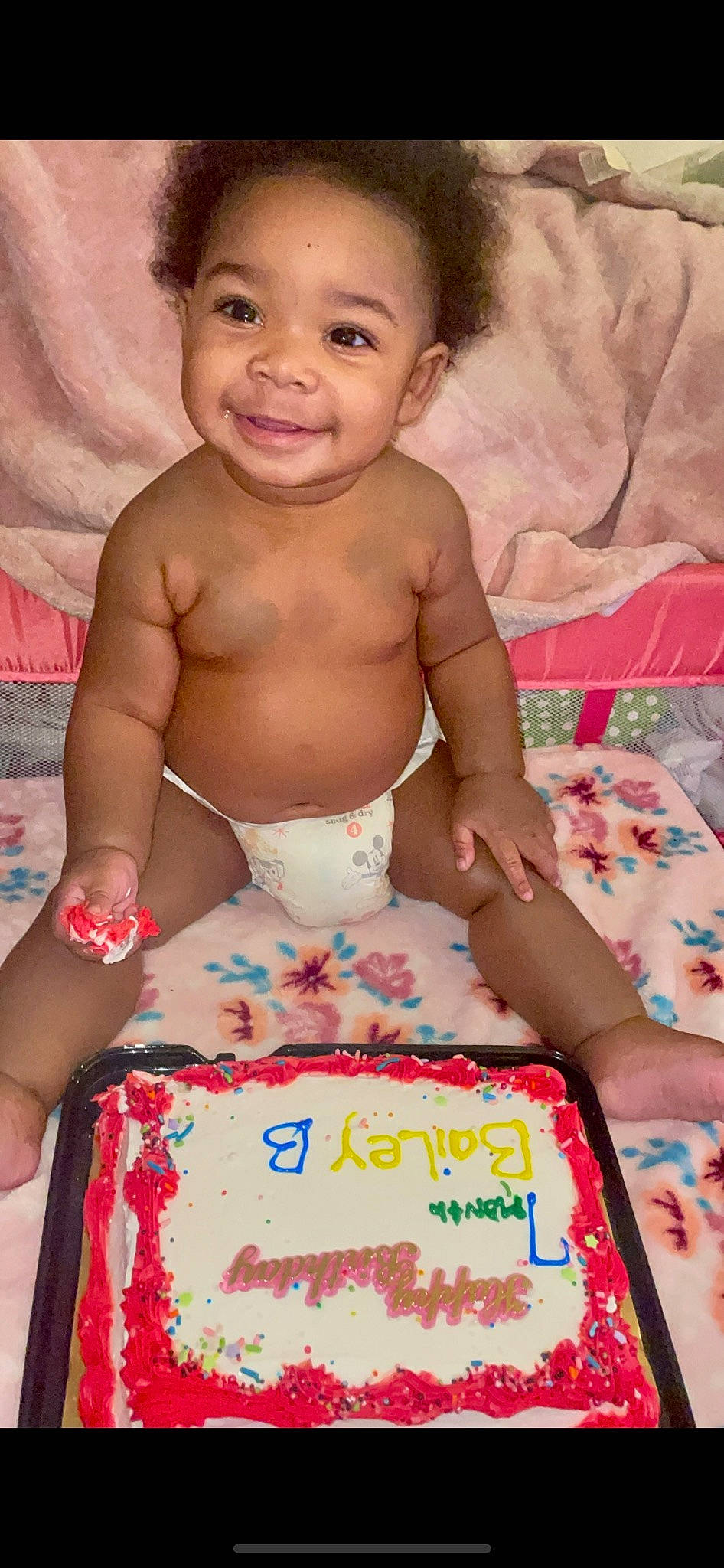 Bailey is registered to the contest to win money with this photo: baby, birthday_cake, cake, cake_decorating, cake_decorating_supply, cheek, chest, child, dessert, event, food, fun, happy, joy, nose, person, pink, skin, smile, sugar_cake