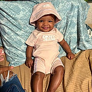 Majesti joined the competition — help win amazing prizes! apparel, baby, bed, child, clothing, cute, fabric, foot, hand, happy, hat, indoors, jeans, pattern, person, pillow, portrait, skin, smile, text