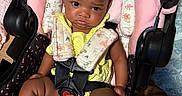 Majesti joined the competition — help win amazing prizes! baby, beaded_clip, blanket, car_seat, child, clothing, cute, floor, hair_bows, indoor, infant, pacifier, person, pink_socks, seated, serious_expression, straps, toddler, wooden_floor, yellow_outfit