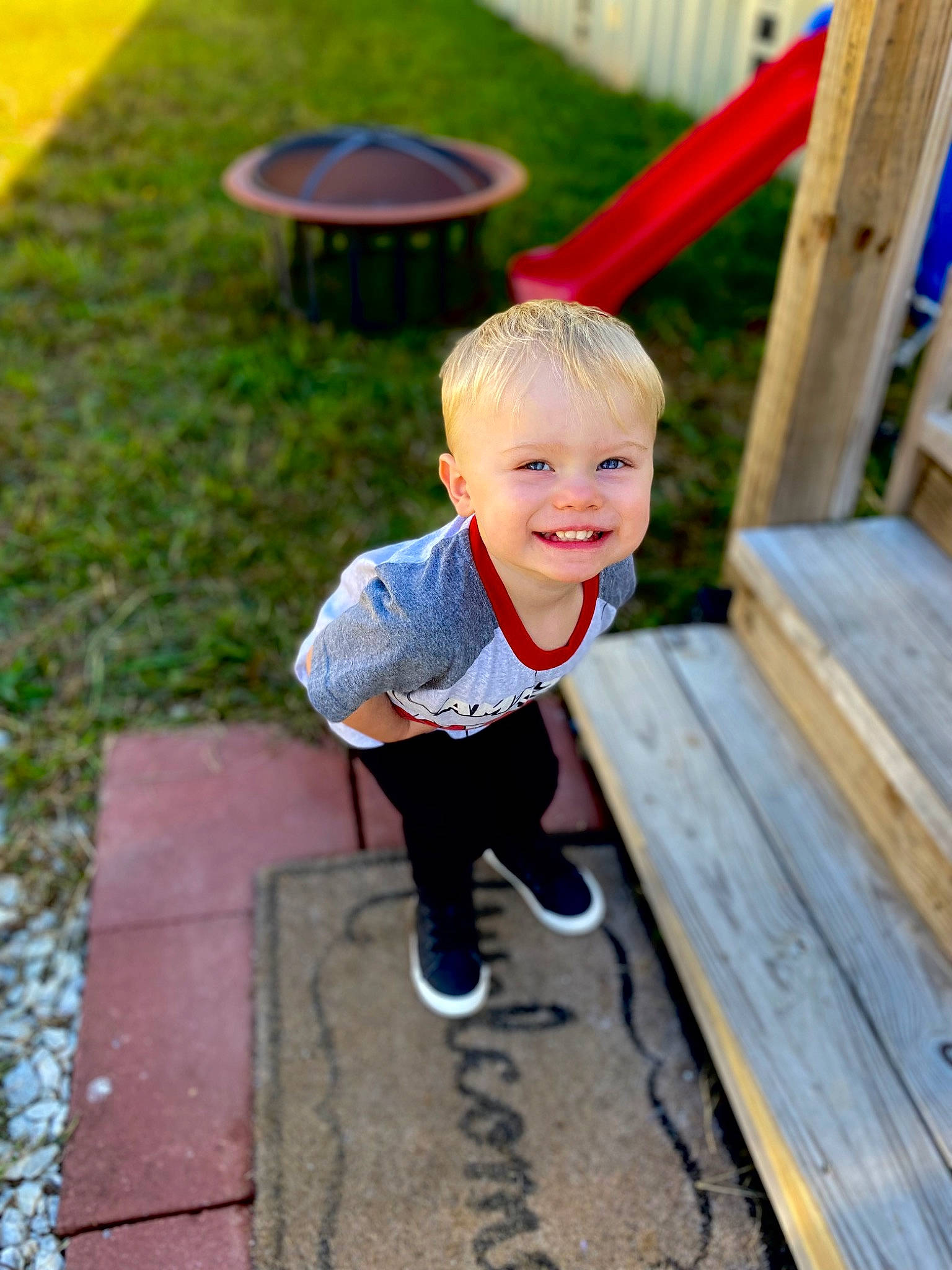 Zane is registered to the contest to win money with this photo: baby, baby_toddler_clothing, blue, child, city, eye, face, fun, grass, happy, head, human_settlement, joy, leisure, person, play, recreation, sitting, smile, toddler