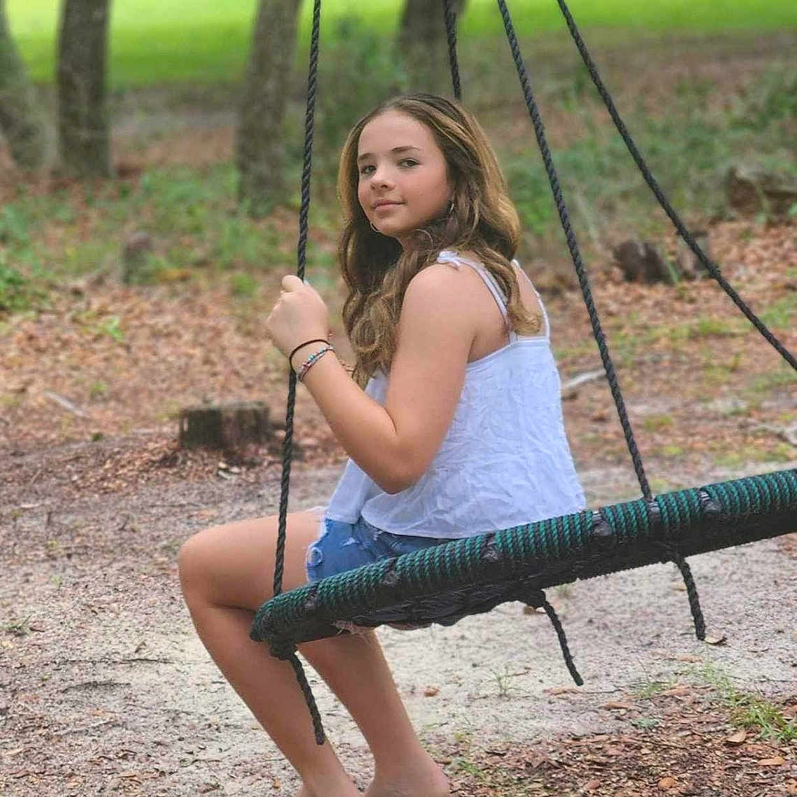 Teanna joined the competition — help win amazing prizes! backyard, barefoot, child, face, female, girl, grass, head, nature, outdoorplayarea, outdoors, park, person, photography, plant, playarea, portrait, sitting, tree, vegetation