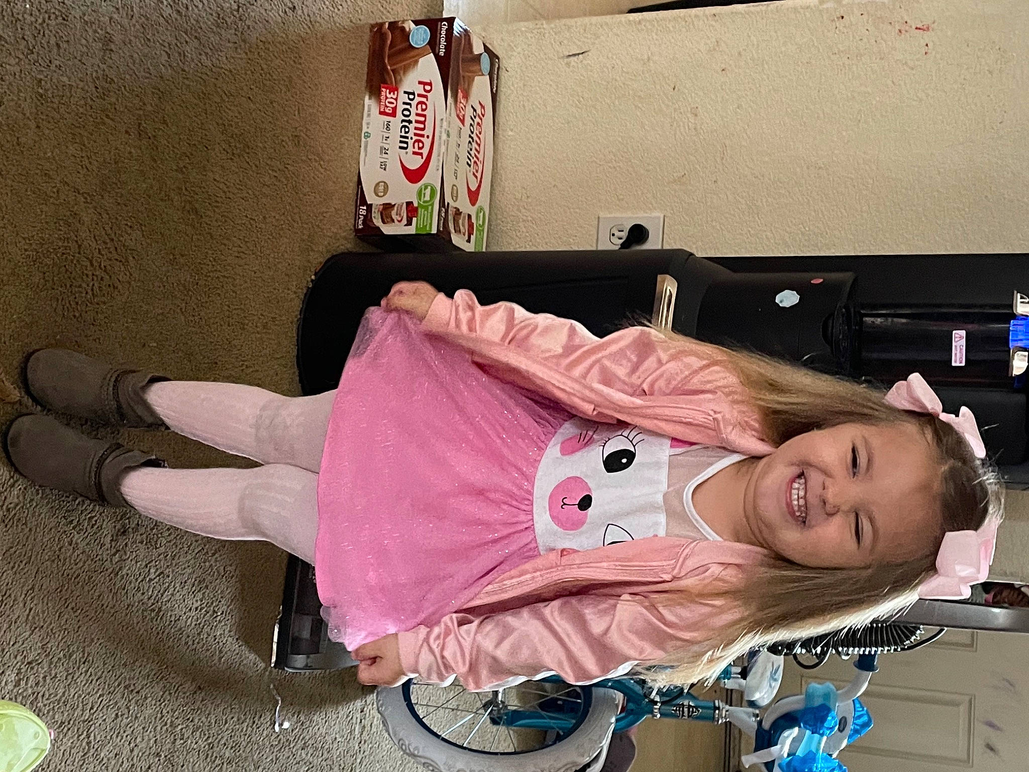 Brooklynn is registered to the contest to win money with this photo: baby_carriage, baby_products, baby_toddler_clothing, carmine, child, comfort, happy, joy, magenta, person, pink, room, shoe, sitting, smile, sneakers, sock, tire, toddler, wheel