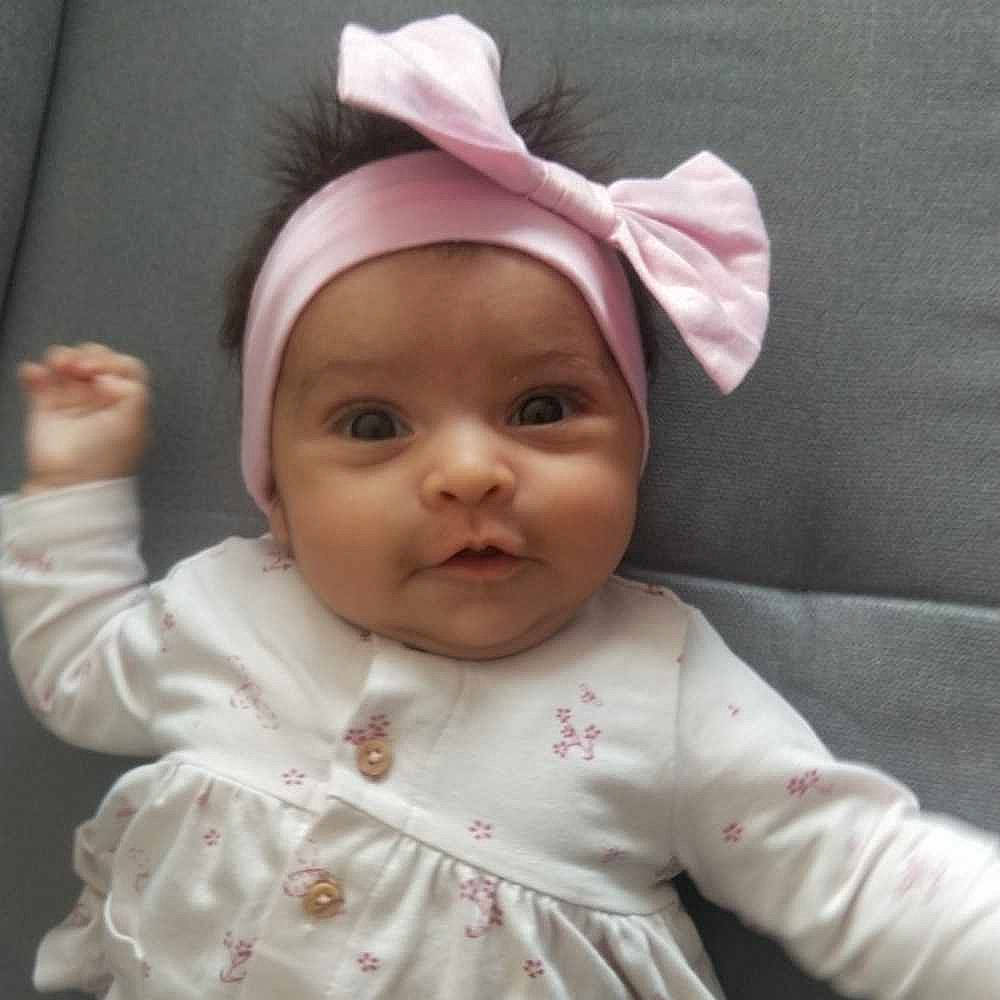 Nila participe au concours pour gagner de l'argent avec cette photo : baby, baby_toddler_clothing, cap, cheek, chin, ear, eye, eyebrow, eyelash, face, happy, head, headwear, iris, lip, mammal, mouth, nose, person, skin