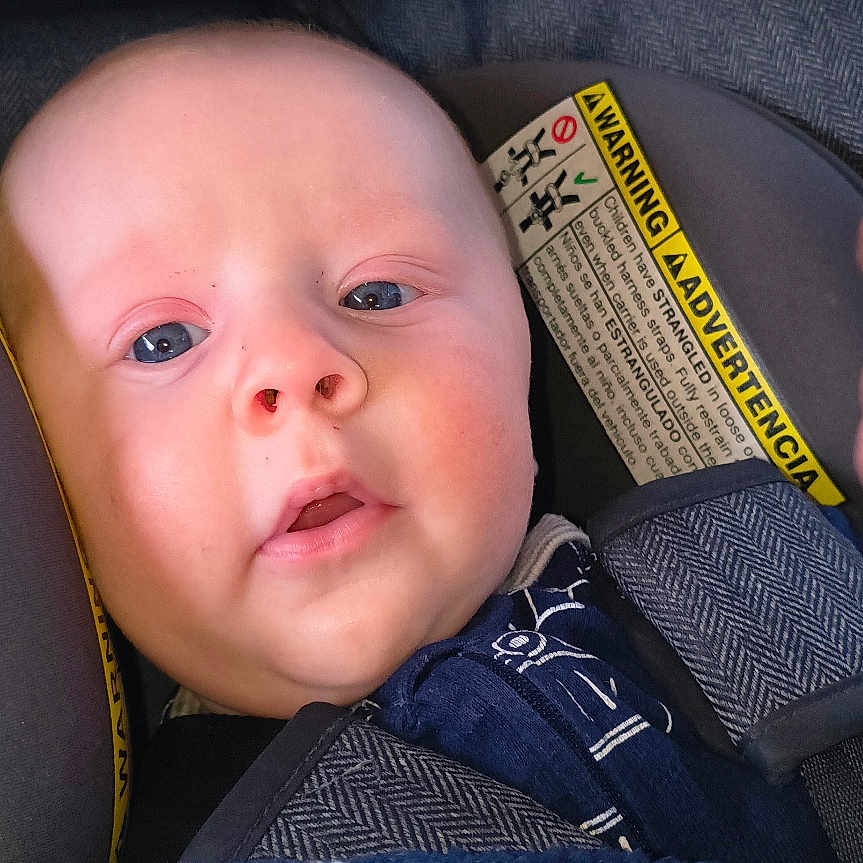 Nova Lane is registered to the contest to win money with this photo: baby, blanket, blue_blanket, canopy, car_seat, child, close_up, clothing, cute, eyes, fabric, face, infant, mouth, nose, portrait, seat_strap, soft_texture, star_pattern, warning_label