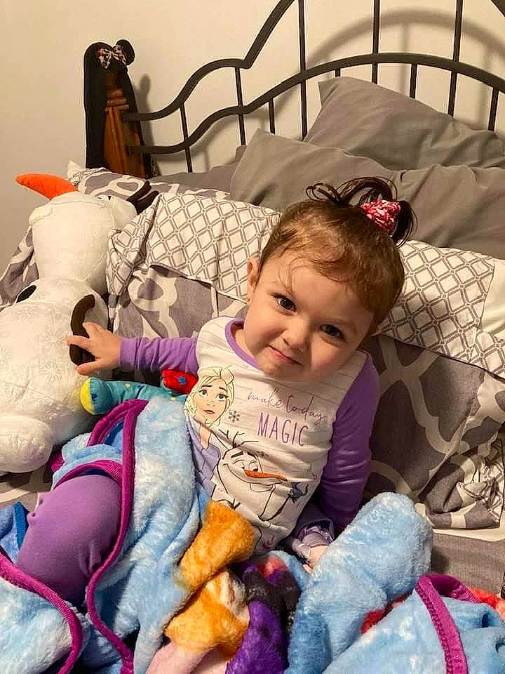 Christina is registered to the contest to win money with this photo: baby_carriage, baby_products, bag, bedding, child, comfort, fun, happy, human, joy, lap, leisure, linens, person, play, room, sitting, smile, toddler, toy