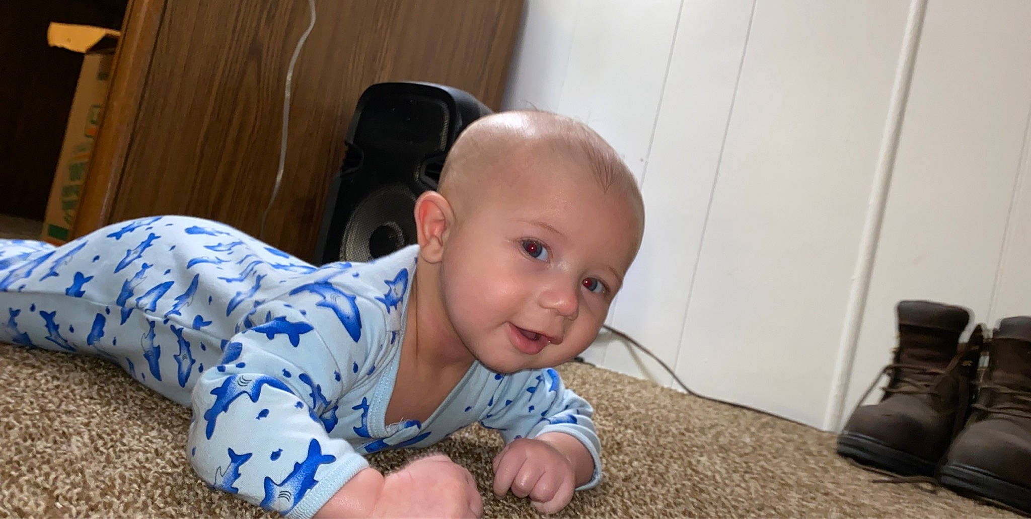 Amani is registered to the contest to win money with this photo: baby, cheek, child, crawling, ear, eye, face, forehead, head, nose, person, sitting, skin, toddler, tummy_time