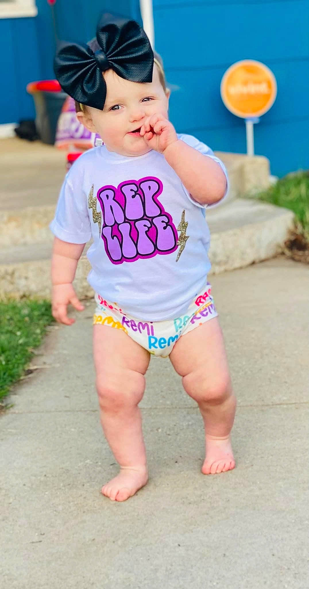 Remingtyn is registered to the contest to win money with this photo: baby_toddler_clothing, blue, child, fun, grass, happy, hat, head, headwear, person, photograph, pink, shorts, skin, sleeve, summer, t_shirt, thigh, toddler, trunk