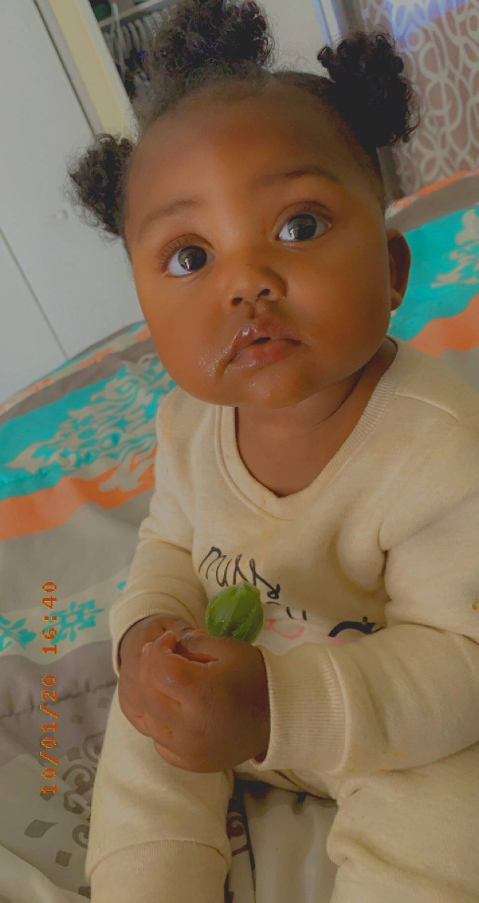 Nyomi is registered to the contest to win money with this photo: baby, baby_grabbing_for_something, baby_toddler_clothing, cheek, child, eye, eyebrow, eyelash, finger, forehead, hair_accessory, headband, headpiece, iris, lip, mouth, nose, person, skin, toddler