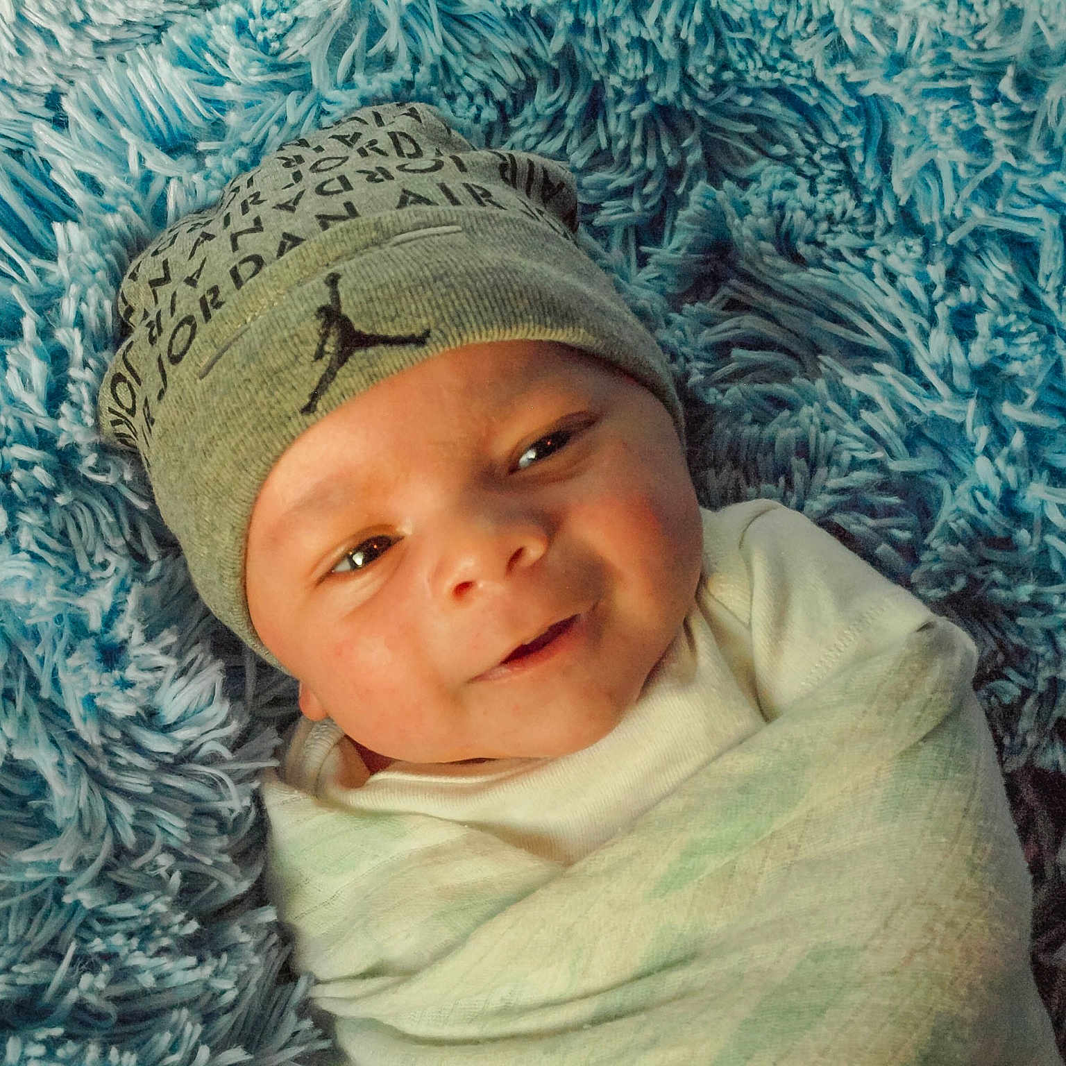 Korbyn is registered to the contest to win money with this photo: beanie, bonnet, cap, cheek, child, eye, face, girl, hat, head, headgear, infant, knit_cap, knitting, person, smile, toddler
