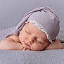baby, sleeping, hat, blanket, soft_texture, pastel_colors, peaceful, closeup, infant, face, cute, resting, cozy, newborn, delicate, portrait, headwear, child, calm, relaxation