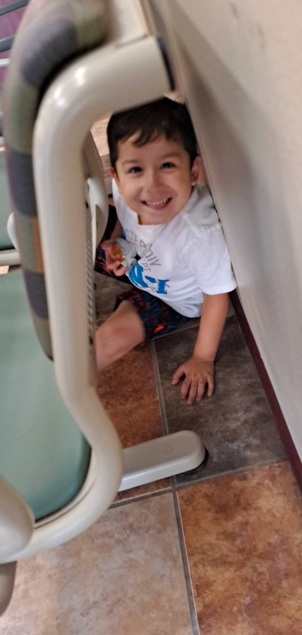 Christopher Javier is registered to the contest to win money with this photo: child, elbow, electric_blue, flash_photography, flooring, fun, happy, joy, leg, leisure, person, photograph, plumbing, plumbing_fixture, shorts, sitting, skin, smile, snapshot, t_shirt