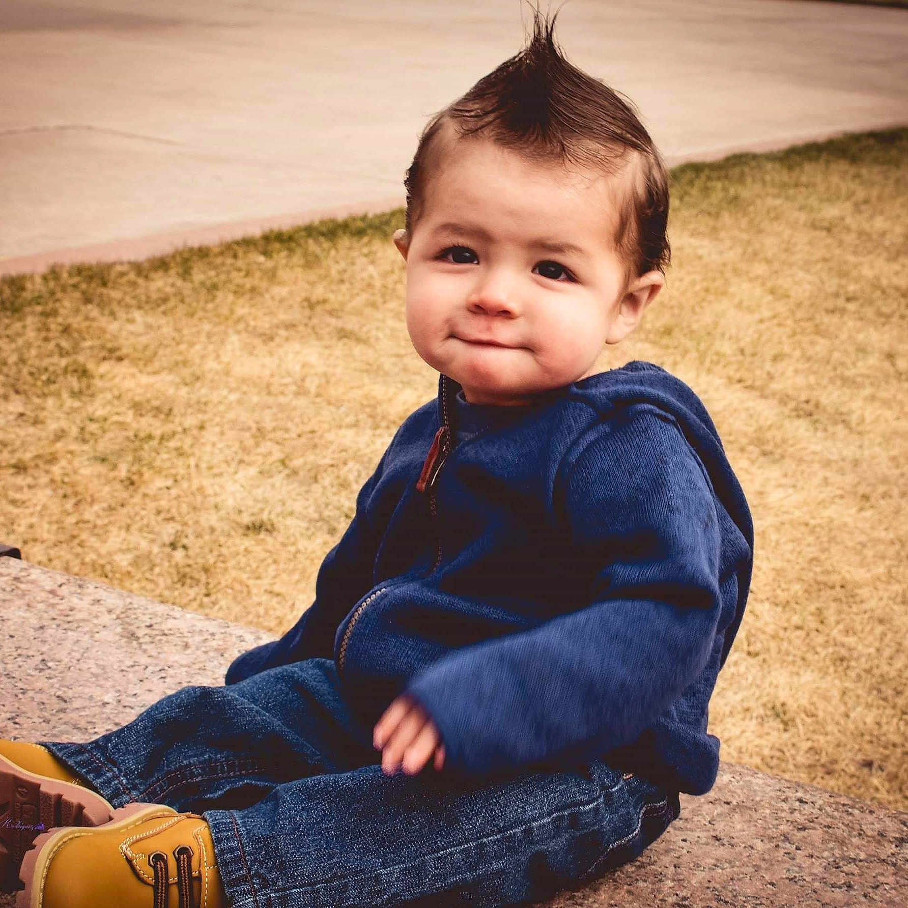 Xavien is registered to the contest to win money with this photo: baby, cheek, child, cool, denim, eye, face, hairstyle, head, human, jeans, joy, leg, male, outerwear, people, person, sitting, skin, sky