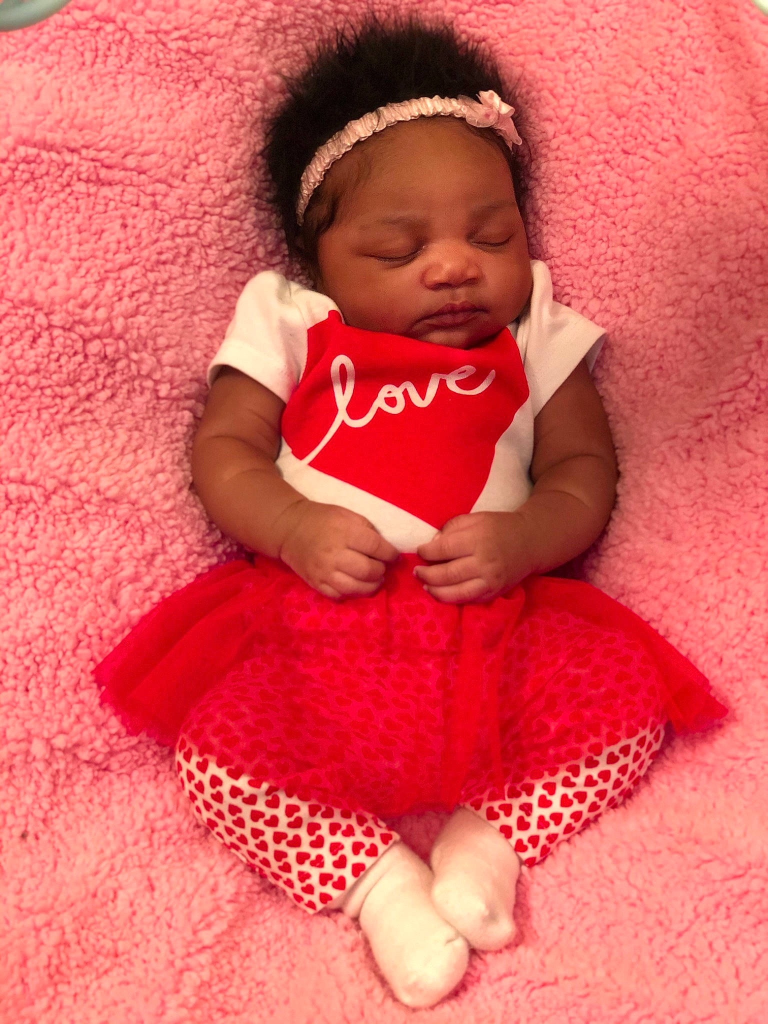 Kyelah joined the competition — help win amazing prizes! baby, baby_products, baby_toddler_clothing, cheek, child, hair_accessory, lip, magenta, pattern, person, pink, product, red, skin, smile, textile, toddler