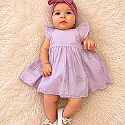 Aisha is registered to the contest to win money with this photo: baby, infant, child, dress, headwrap, bow, shoes, white_shoes, fluffy_rug, purple_dress, cute, lying_down, portrait, indoors, soft_texture, adorable, young_child, fashion, comfortable, happy