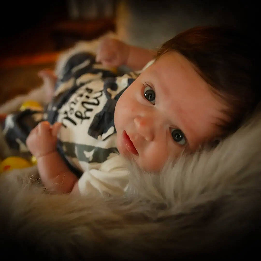 Koda is registered to the contest to win money with this photo: baby, beard, carmine, cheek, chin, close_up, comfort, eyebrow, eyelash, facial_hair, fur, hair, happy, head, mammal, mouth, nose, person, room, smile